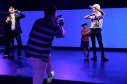 A child poses for a photo with a waxwork model of Kpop star G-Dragon on the opening day of the first Asian outpost of France's famous waxwork museum, Musee Grevin, in Seoul on July 30, 2015. The new museum's focus is firmly on the world of entertainment and, in particular, stars of the "Hallyu" or "Korean Wave" of pop songs and TV melodramas that have become the country's most potent cultural export. ©AFP PHOTO / Ed Jones