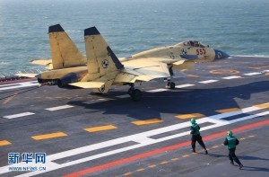China conducts first landing on aircraft carrier