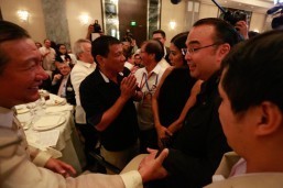 Presidential candidate Davao Mayor Rodrigo Duterte and running mate Sen. Alan Peter Cayetano arrive at the Makati Business Club forum on Wednesday. Duterte talked about his plans on how to fight crime and corruption, and said he is not the man he is portrayed to be by some.(MNS photo)