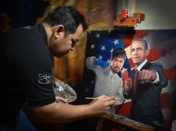 Pinoy Hall of Famer: Jun Aquino who will join the prestigious roster of West Coast Hall of Fame on Sept. 25 at the Garland Event Center in Hollywood in the Boxing-Artist Category does finishing touches on a painting of Manny Pacquiao and President Barrack Obama.