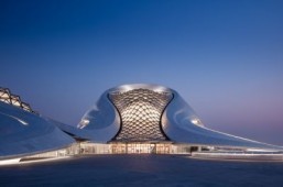 Harbin Opera House: night view of the main entrance to the grand lobby featuring the crystalline skylight ©Adam Mørk